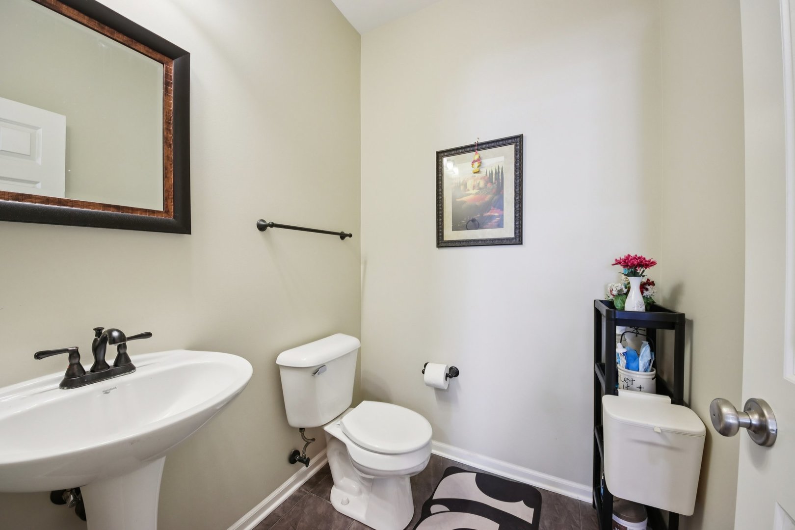 424 Acushnet Street Elgin, IL 60124 - Photo 9 of 21 a bathroom with a toilet sink and mirror