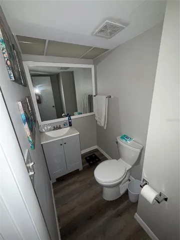 a white toilet sitting next to a white toilet