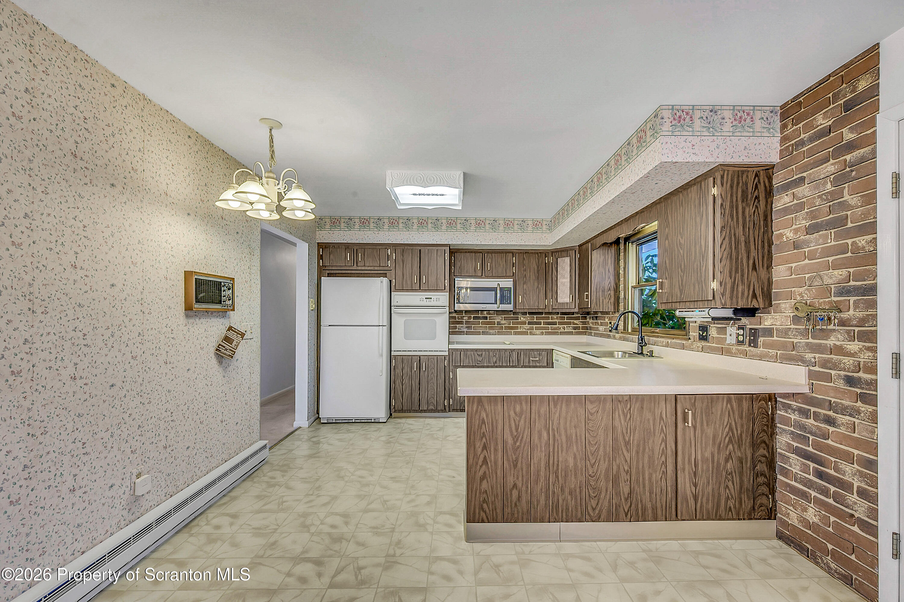 803 June Lane Moosic, PA 18507 - Photo 12 of 36 a spacious bathroom with a sink a large mirror and a shower