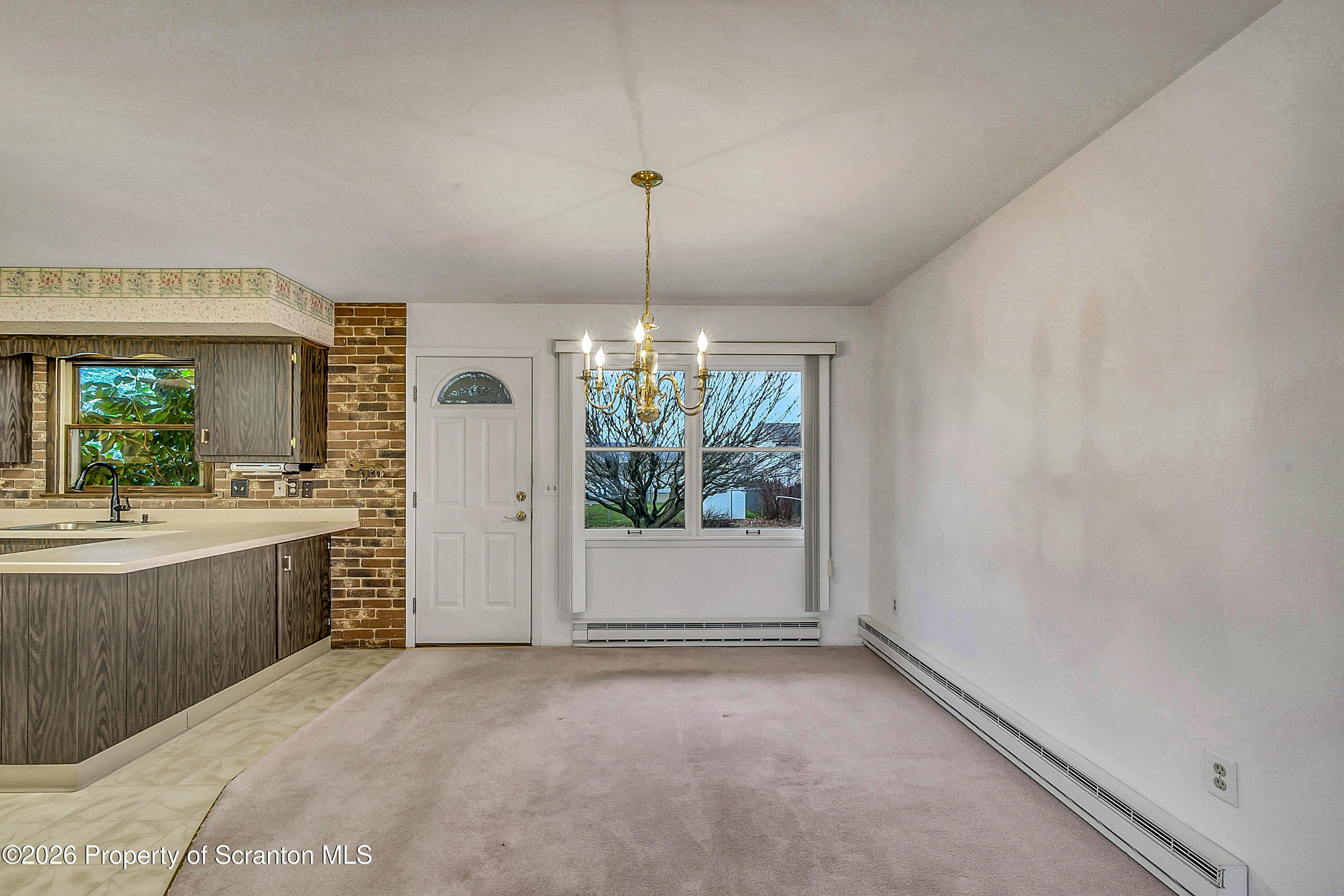 803 June Lane Moosic, PA 18507 - Photo 13 of 36 a view of a kitchen with a sink and window