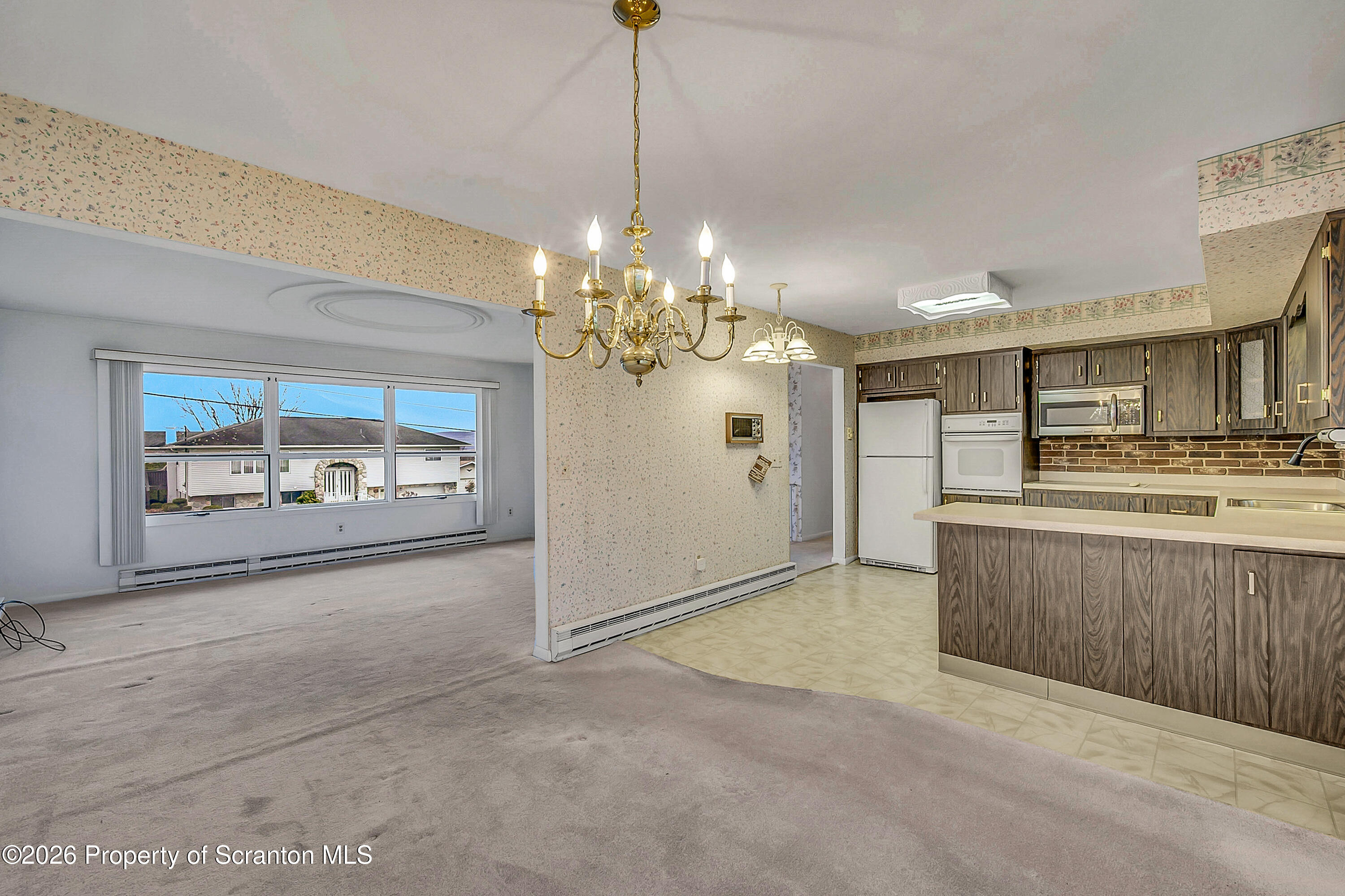803 June Lane Moosic, PA 18507 - Photo 14 of 36 a view of a kitchen and a chandelier