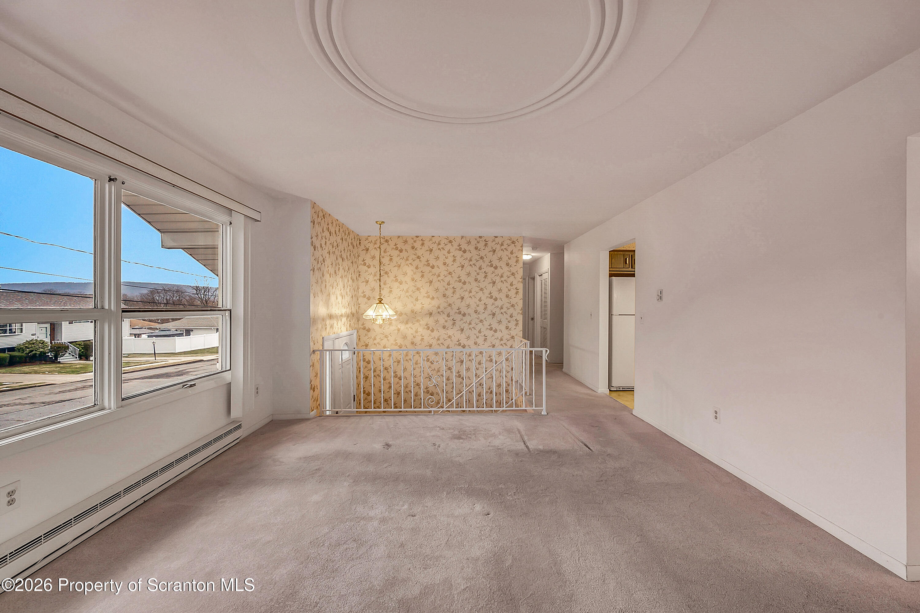 803 June Lane Moosic, PA 18507 - Photo 16 of 36 a view of a livingroom with an empty space and a window