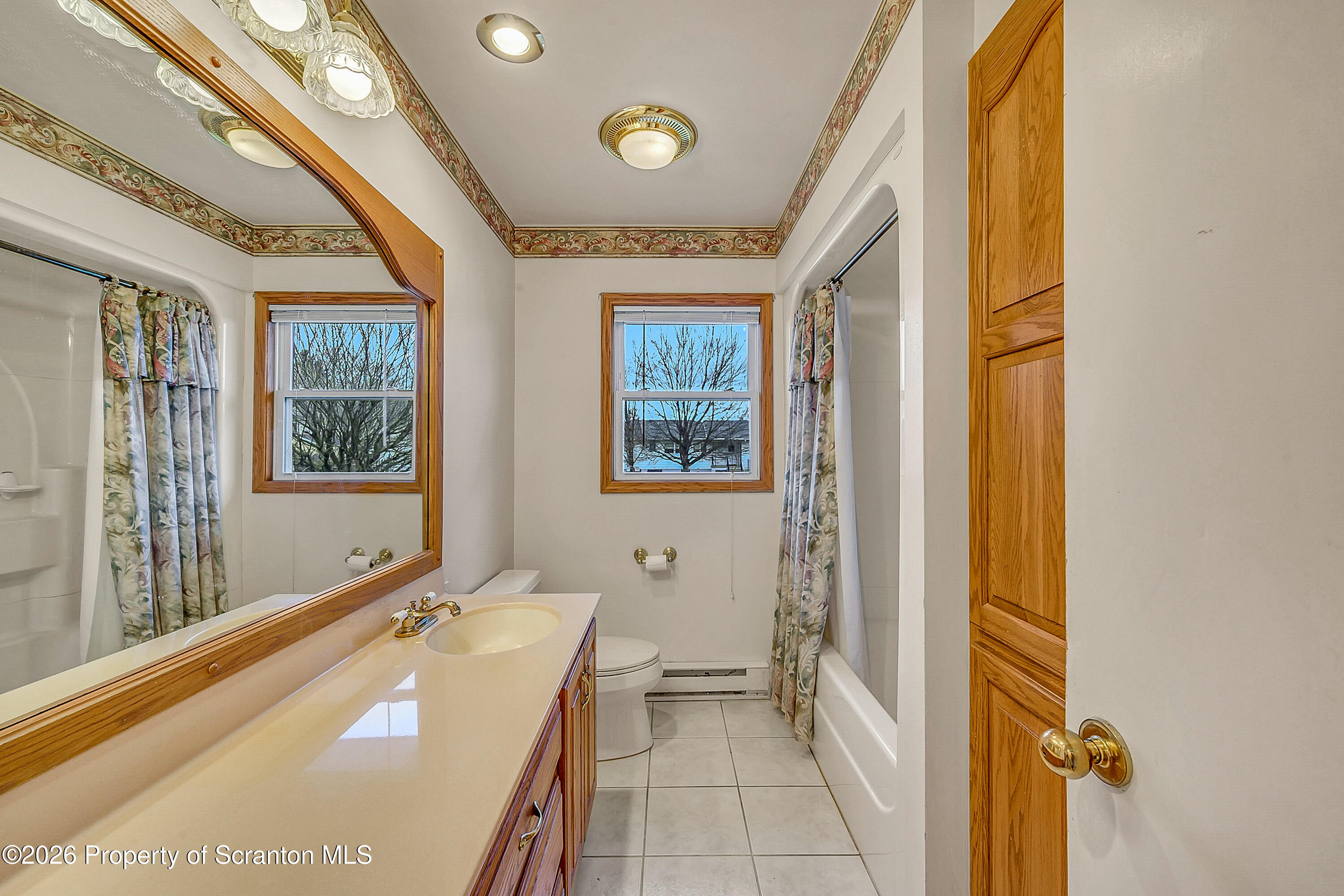 803 June Lane Moosic, PA 18507 - Photo 19 of 36 a bathroom with a tub and a sink