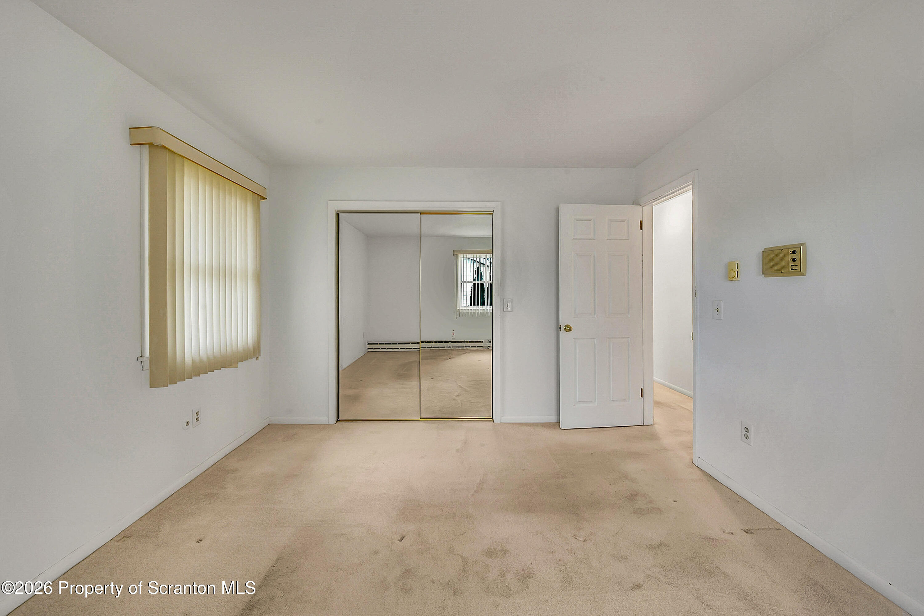 803 June Lane Moosic, PA 18507 - Photo 22 of 36 an empty room with windows and closet