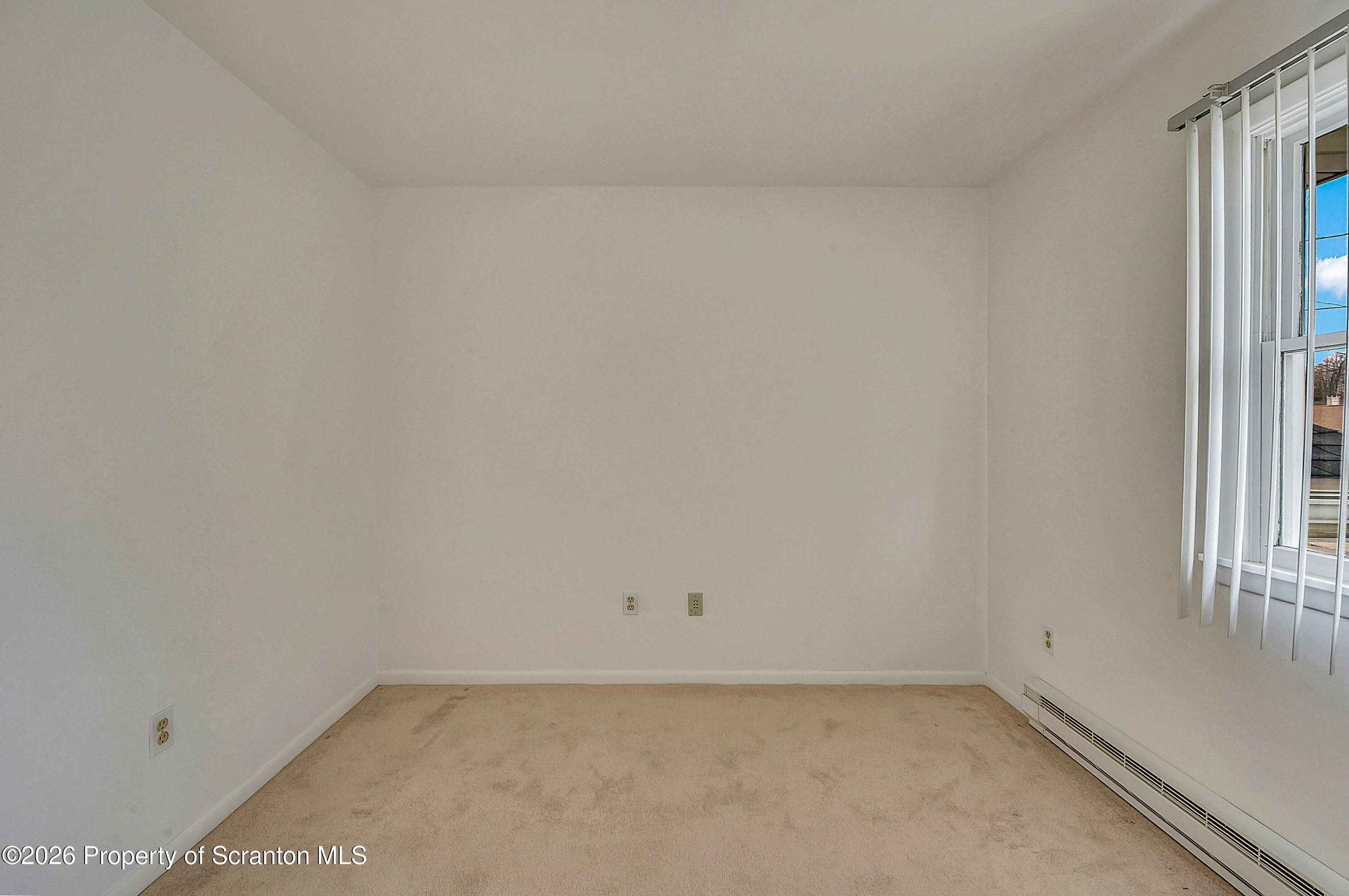 803 June Lane Moosic, PA 18507 - Photo 23 of 36 an empty room with a window