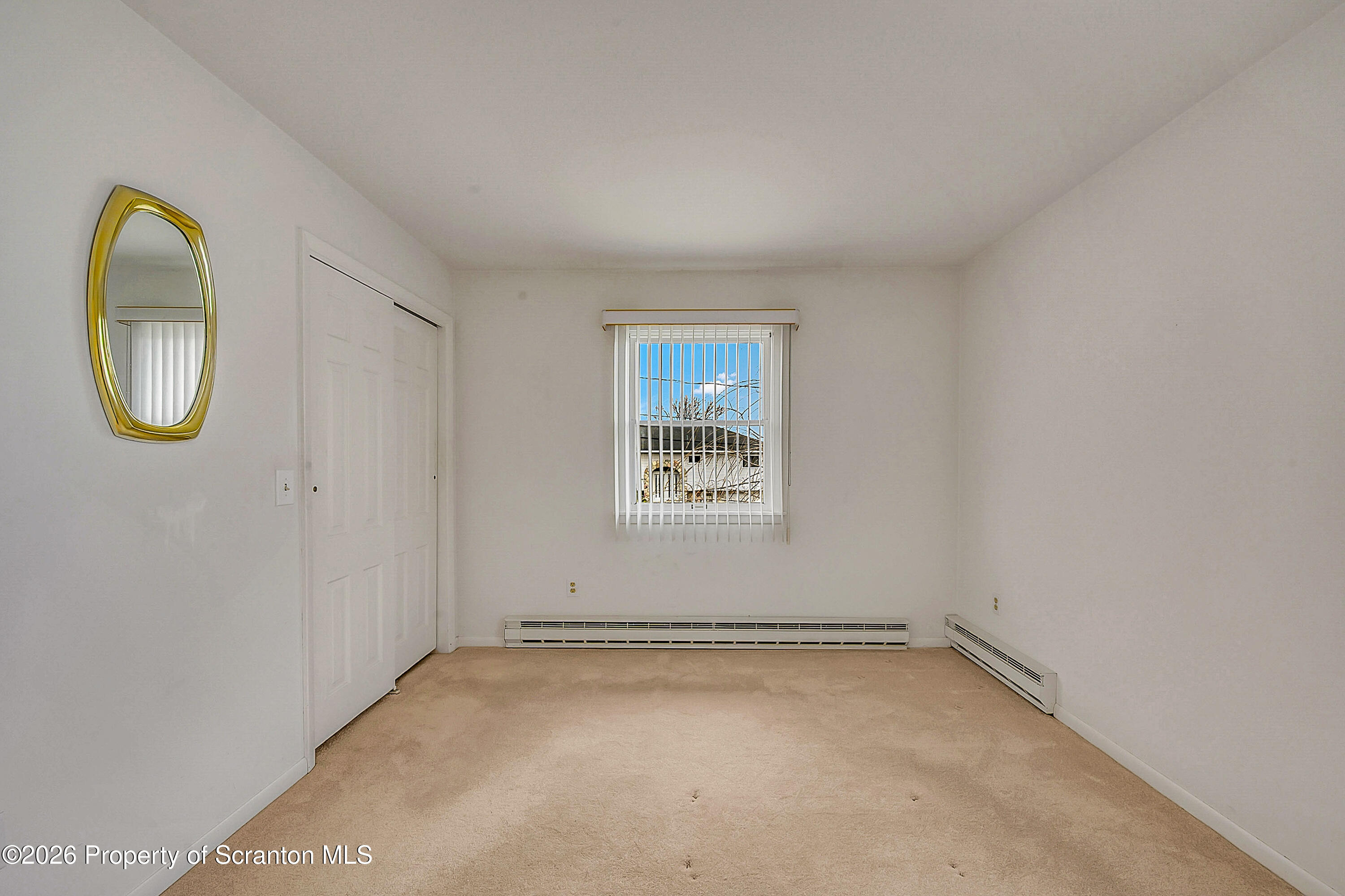 803 June Lane Moosic, PA 18507 - Photo 24 of 36 an empty room with a window