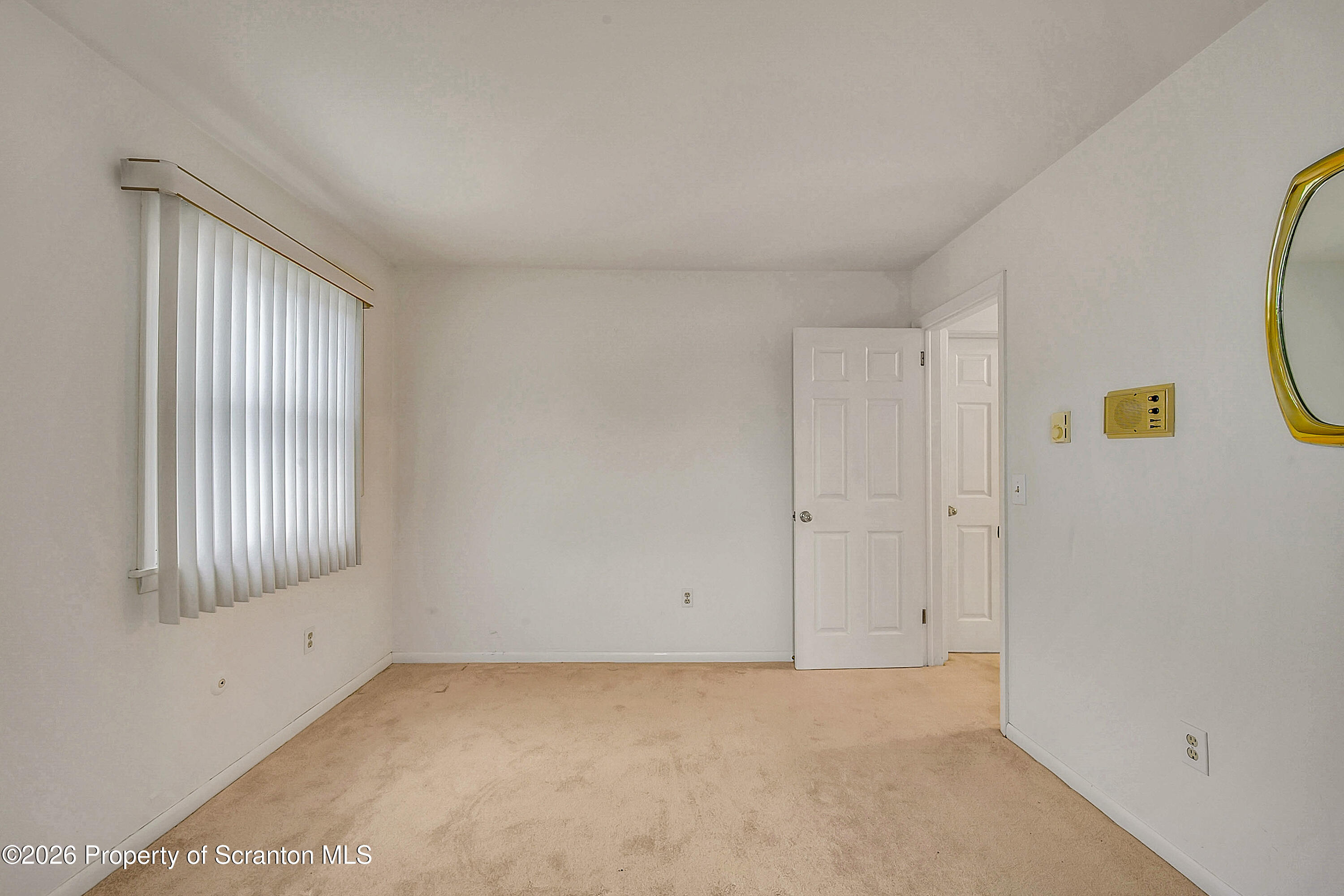 803 June Lane Moosic, PA 18507 - Photo 26 of 36 a view of an empty room with a window