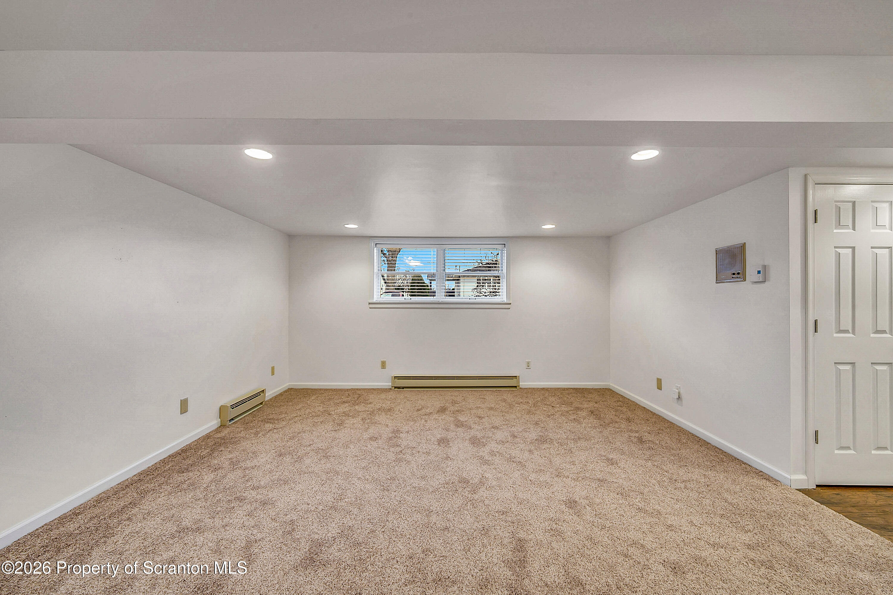 803 June Lane Moosic, PA 18507 - Photo 29 of 36 a view of an empty room and a window