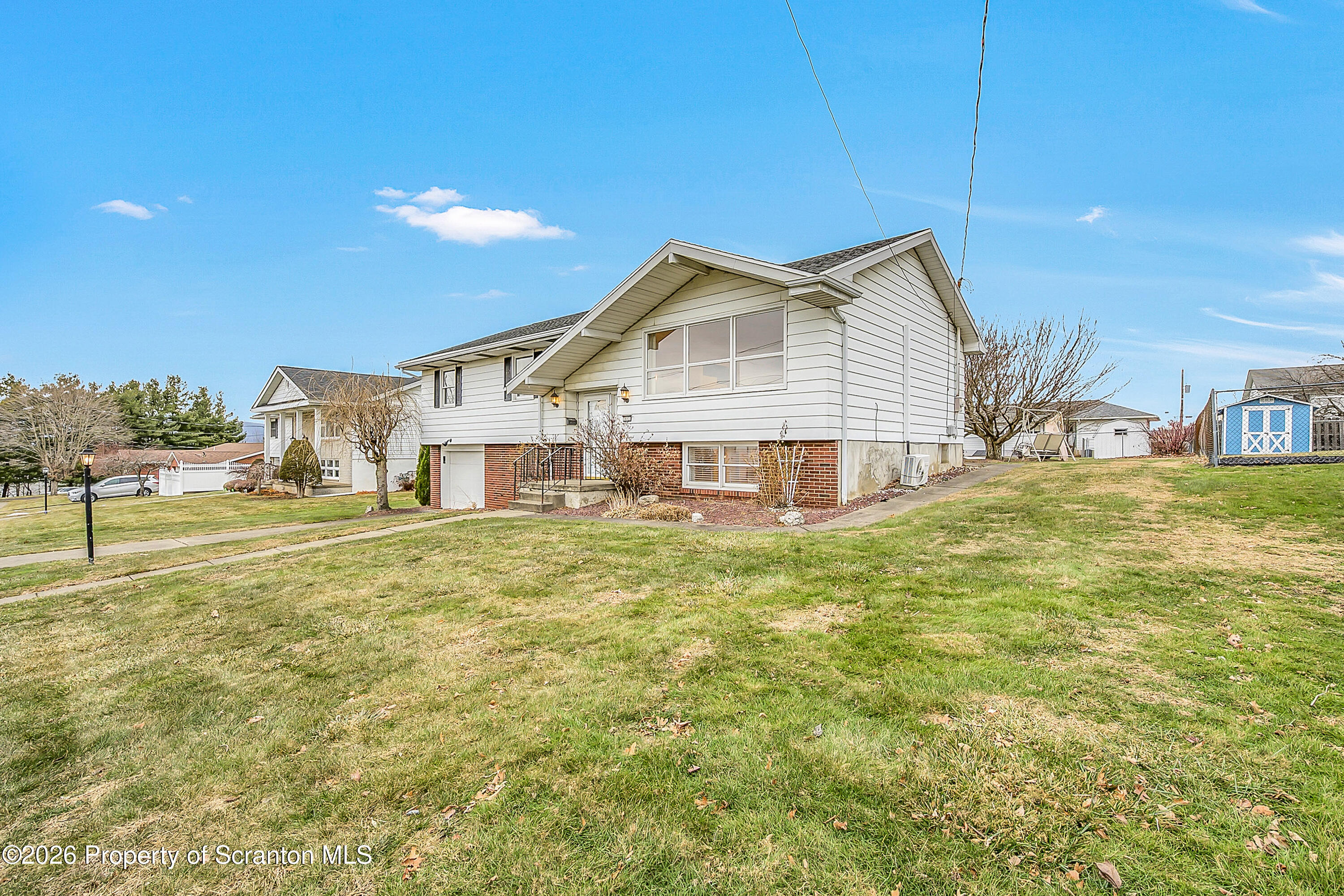 803 June Lane Moosic, PA 18507 - Photo 3 of 36 a view of a house with a big yard