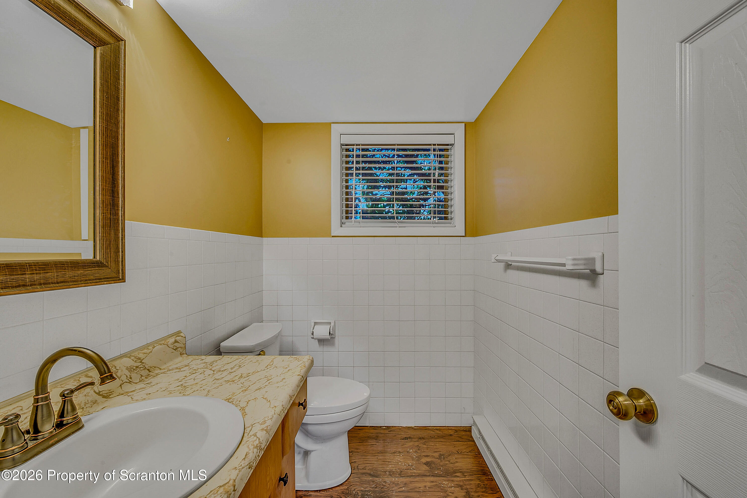 803 June Lane Moosic, PA 18507 - Photo 31 of 36 a bathroom with a sink and a mirror