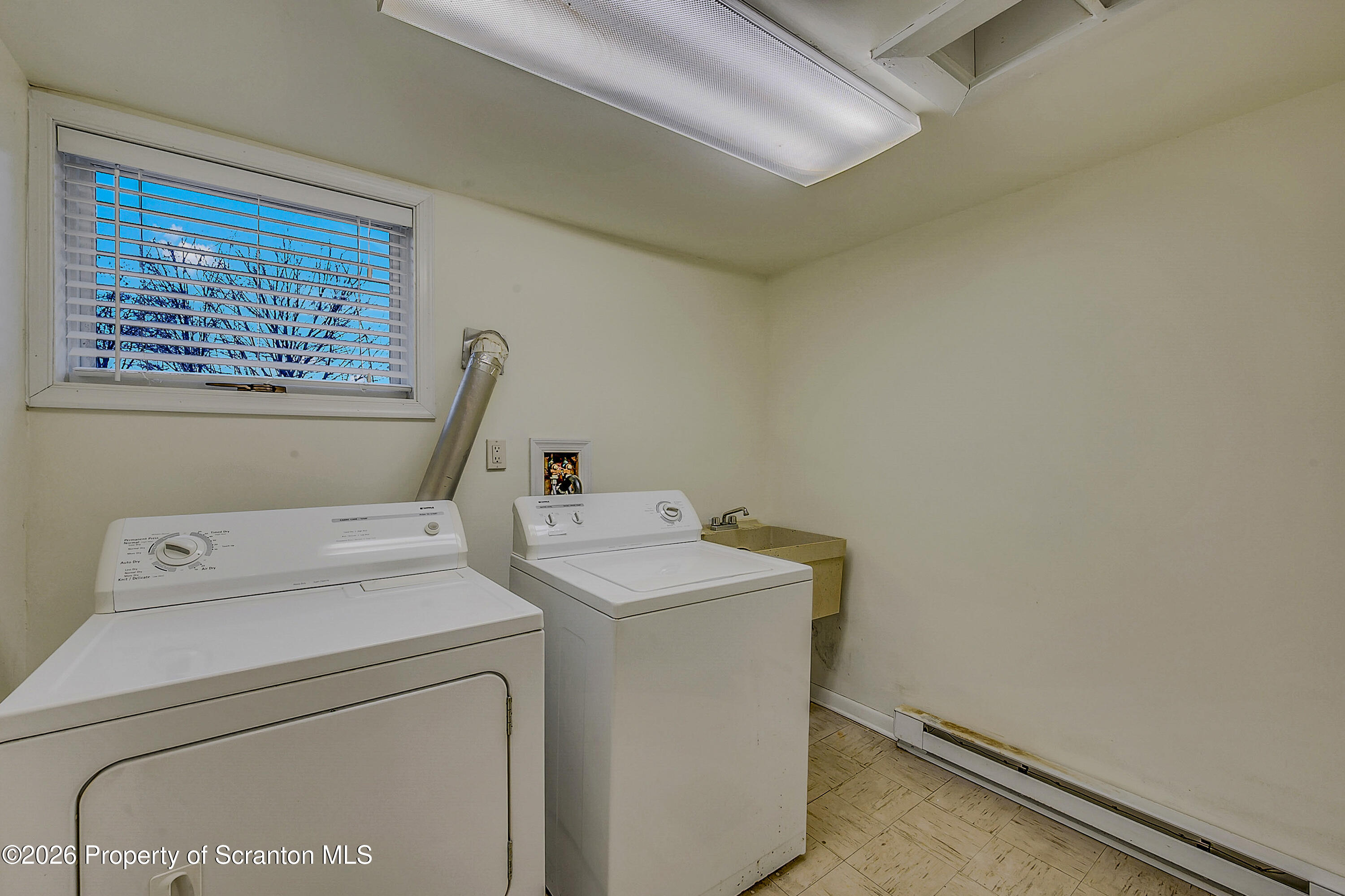 803 June Lane Moosic, PA 18507 - Photo 33 of 36 a utility room with dryer and washer