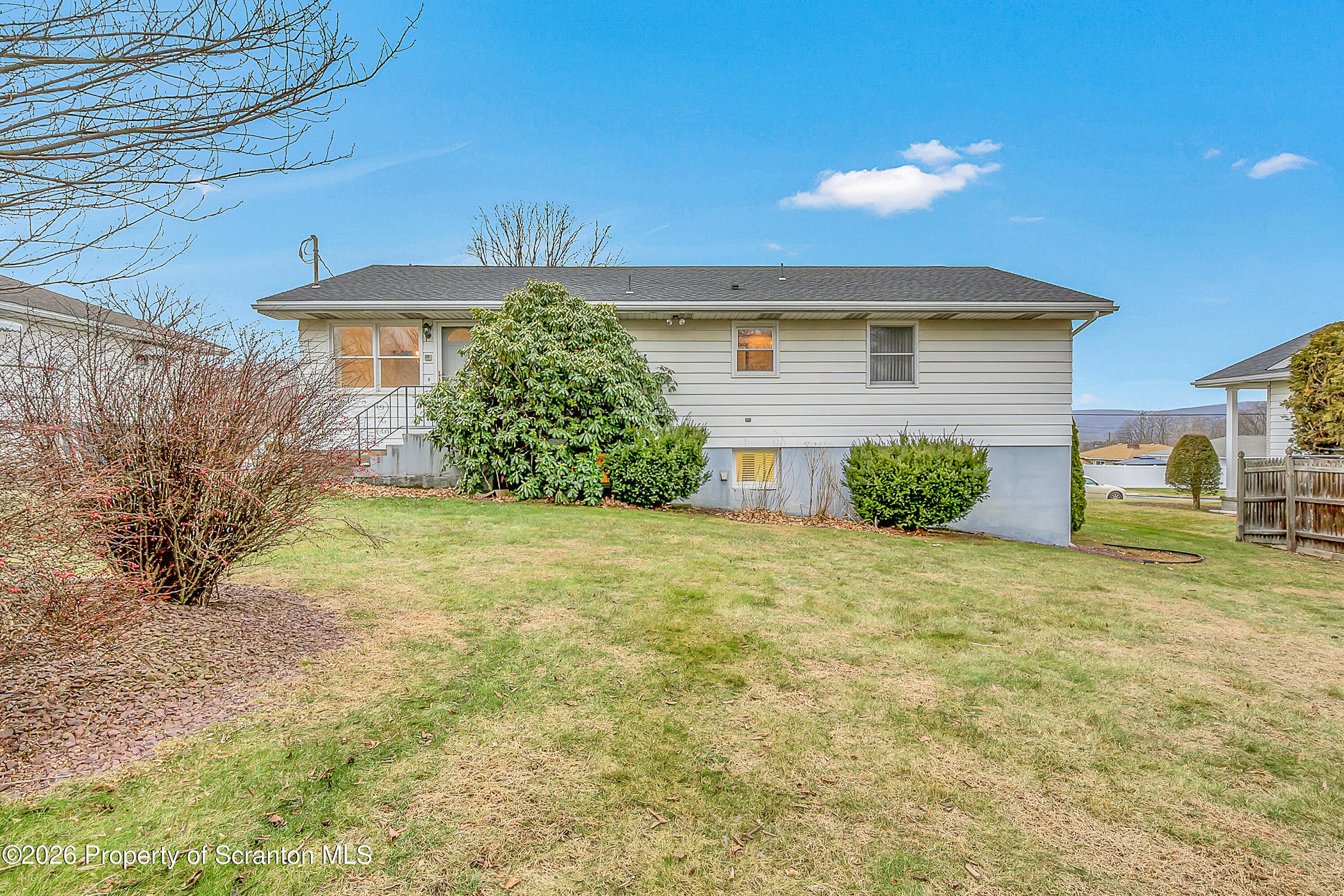 803 June Lane Moosic, PA 18507 - Photo 4 of 36 a front view of a house with a yard