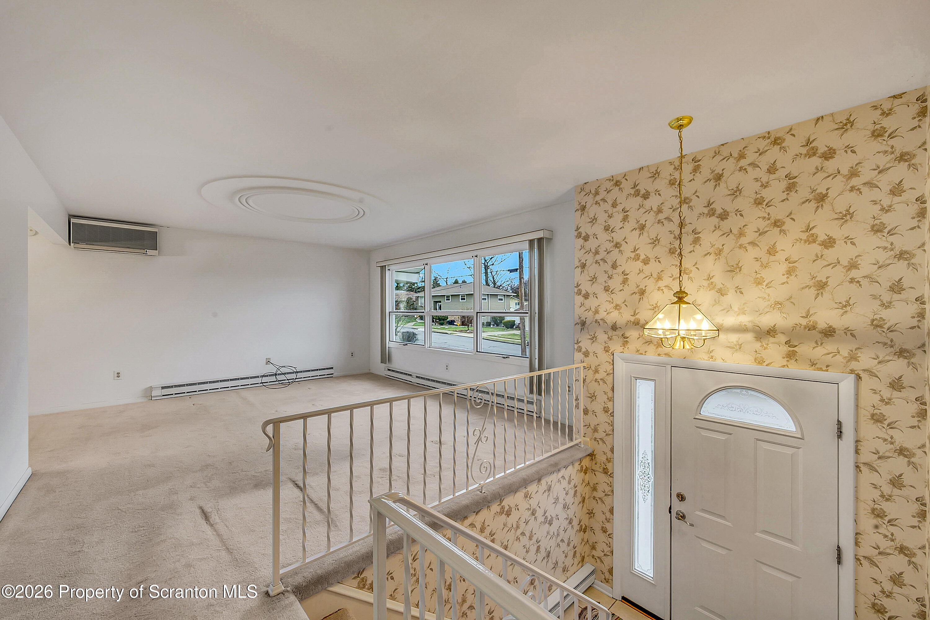 803 June Lane Moosic, PA 18507 - Photo 8 of 36 a view of a bedroom with wooden floor and windows
