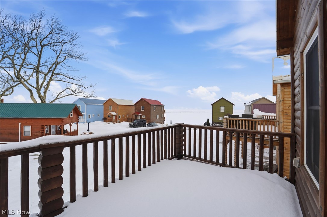 5919 Lake Road West, Unit 33 Ashtabula, OH 44004 - Photo 18 of 22 Snow covered deck with a residential view