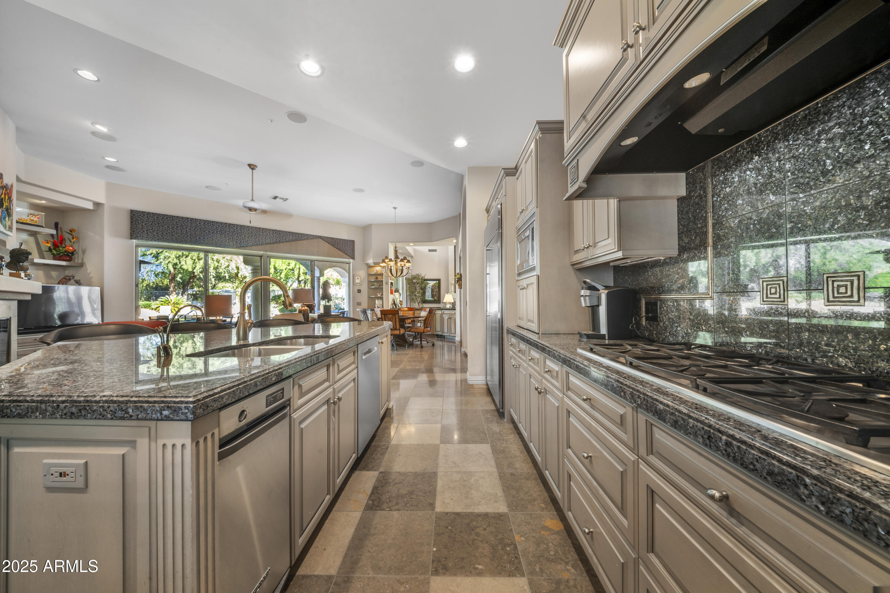 8350 East Via Del Sol Drive Scottsdale, AZ 85255 - Photo 14 of 42 a large kitchen with stainless steel appliances granite countertop lots of counter top space