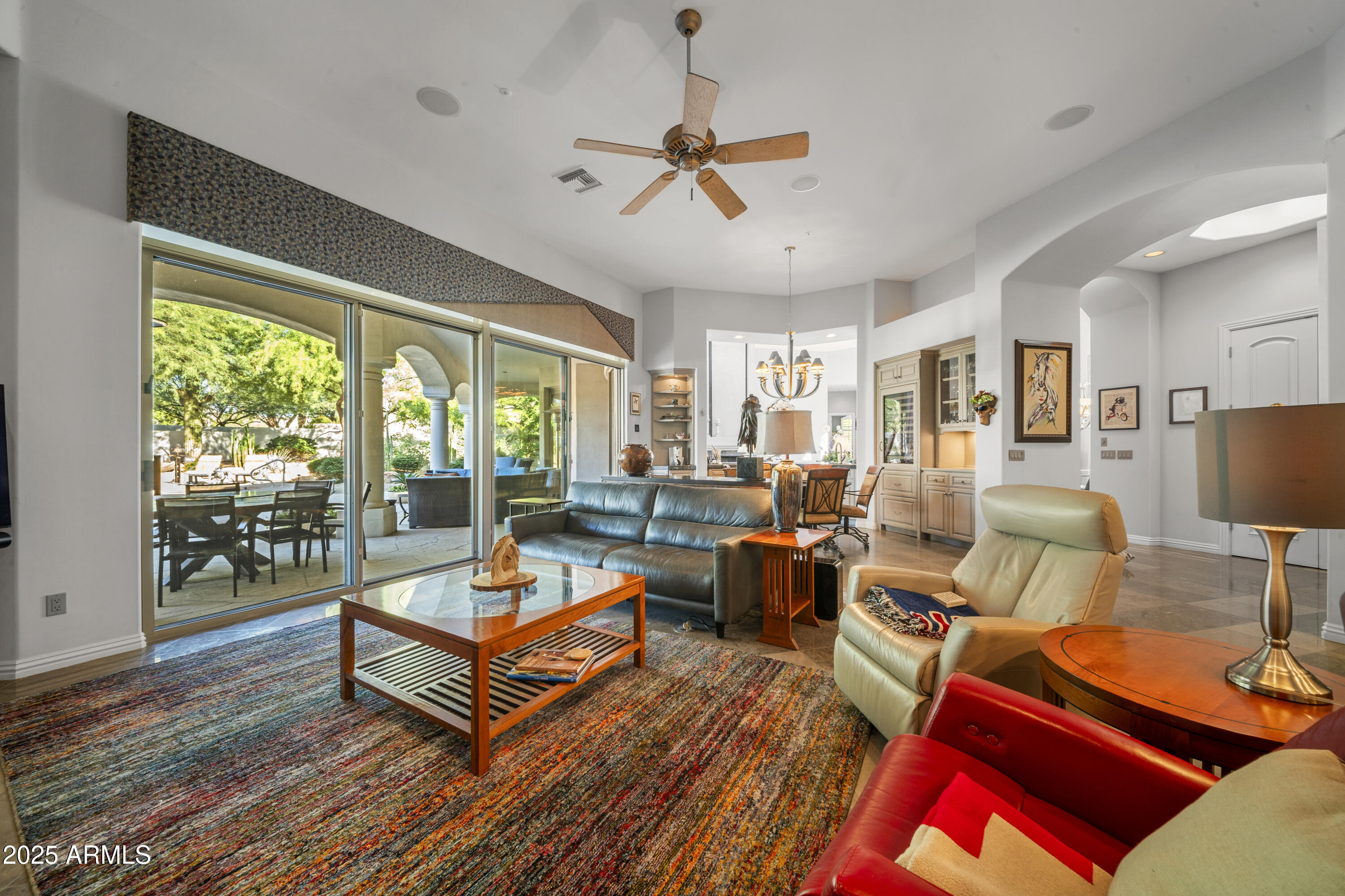 8350 East Via Del Sol Drive Scottsdale, AZ 85255 - Photo 16 of 42 a living room with furniture a rug and a large window