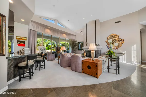 a living room with furniture and a large window