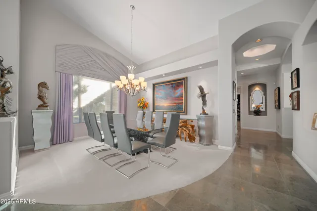 a view of a livingroom with furniture and a chandelier