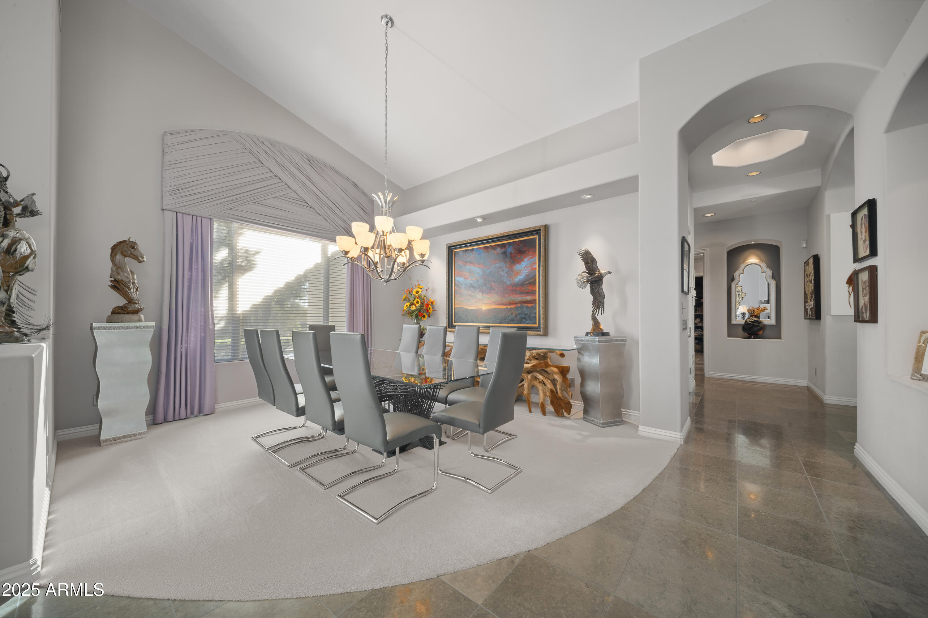 8350 East Via Del Sol Drive Scottsdale, AZ 85255 - Photo 19 of 42 a view of a livingroom with furniture and a chandelier