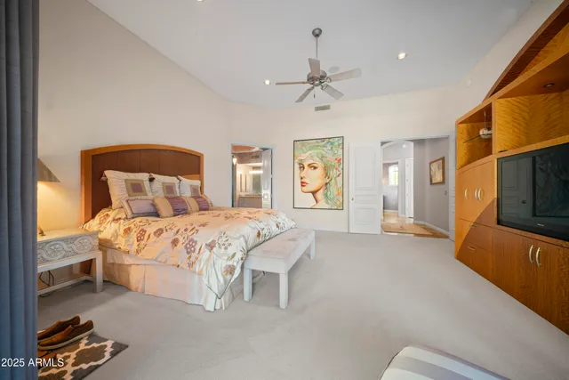 a bedroom with a bed and a couch