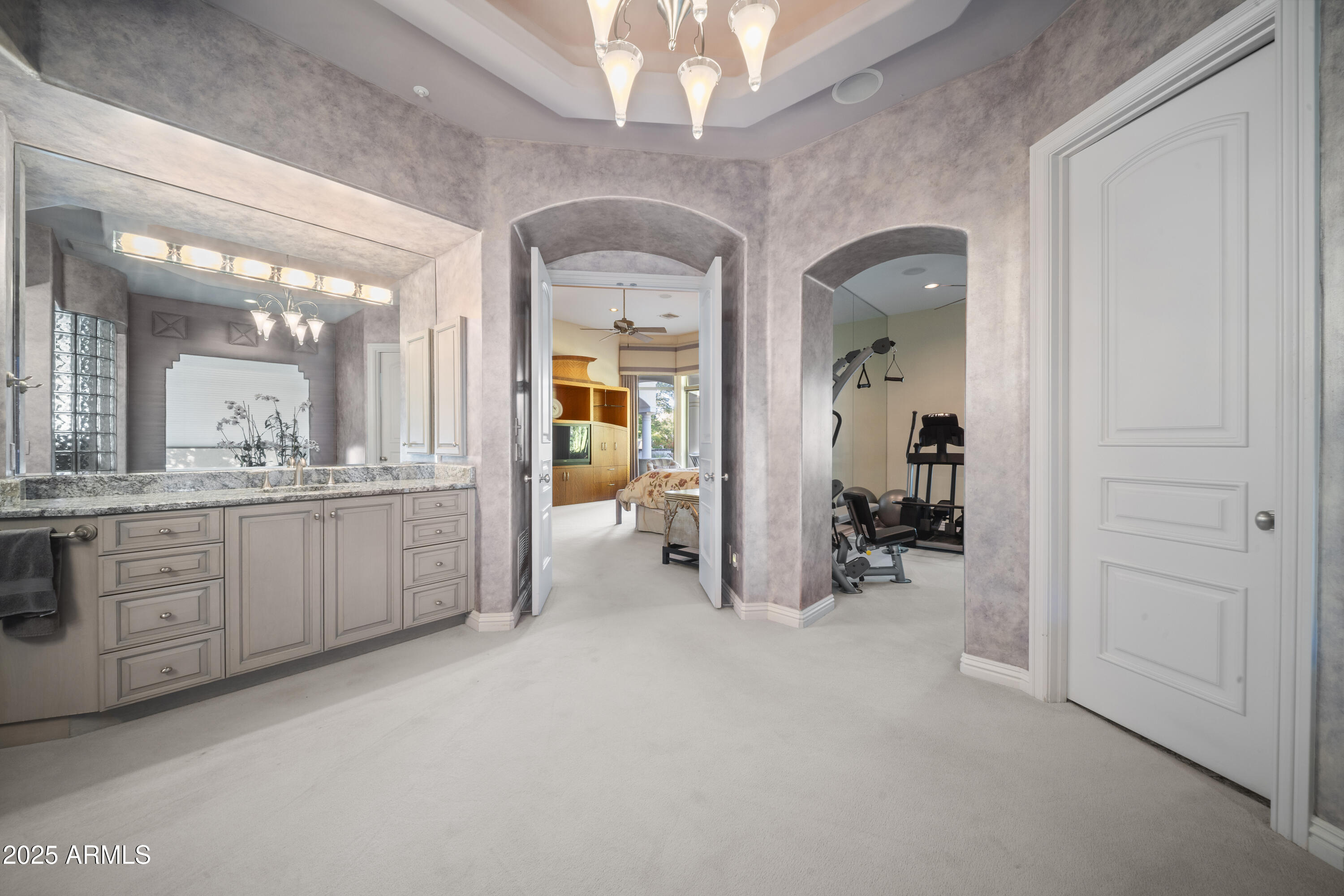 8350 East Via Del Sol Drive Scottsdale, AZ 85255 - Photo 25 of 42 a large room with a mirror and a view of living room