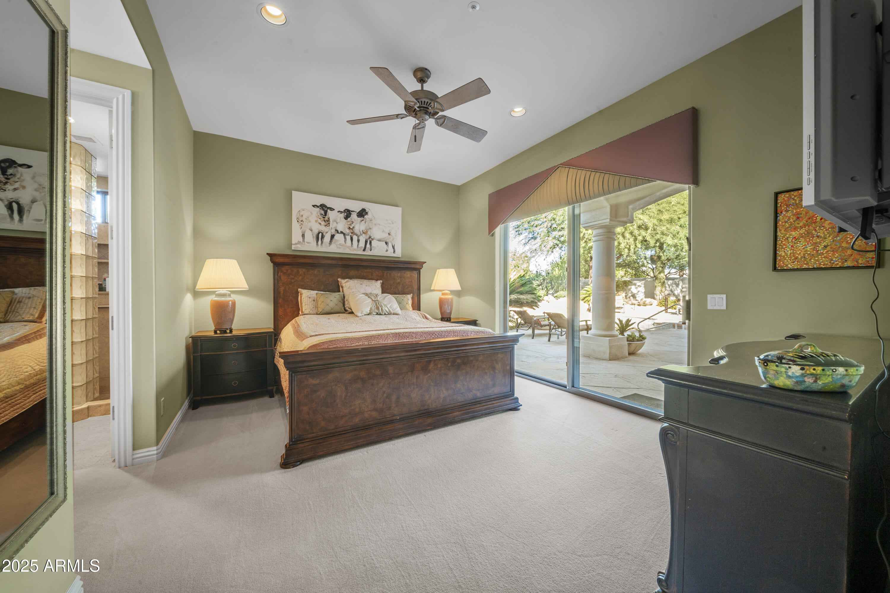 8350 East Via Del Sol Drive Scottsdale, AZ 85255 - Photo 27 of 42 a bedroom with a bed and a tv