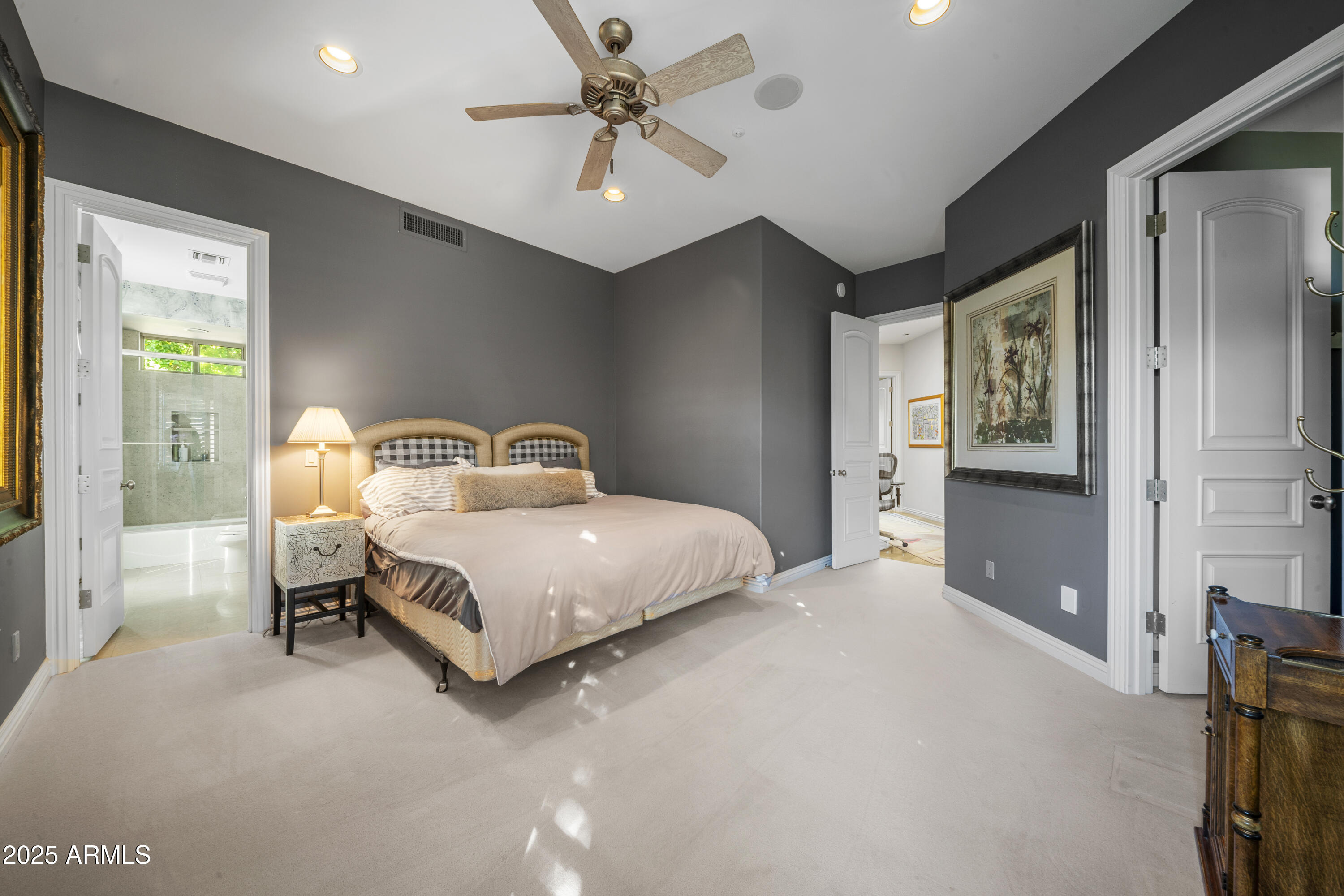 8350 East Via Del Sol Drive Scottsdale, AZ 85255 - Photo 30 of 42 a bedroom with a bed and a chandelier