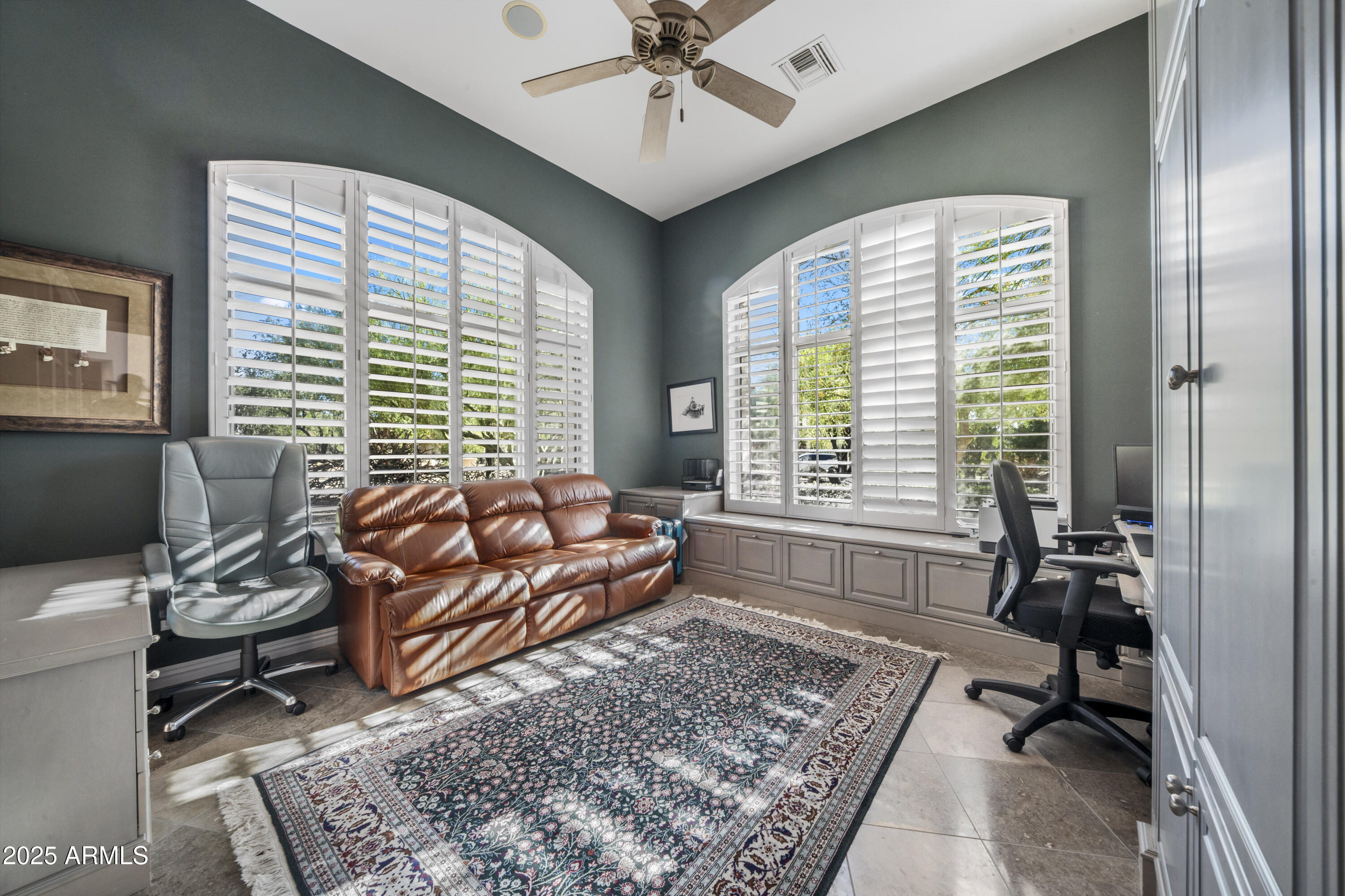 8350 East Via Del Sol Drive Scottsdale, AZ 85255 - Photo 33 of 42 a living room with furniture and a rug