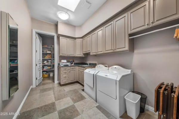 a kitchen with a stove top oven and cabinets
