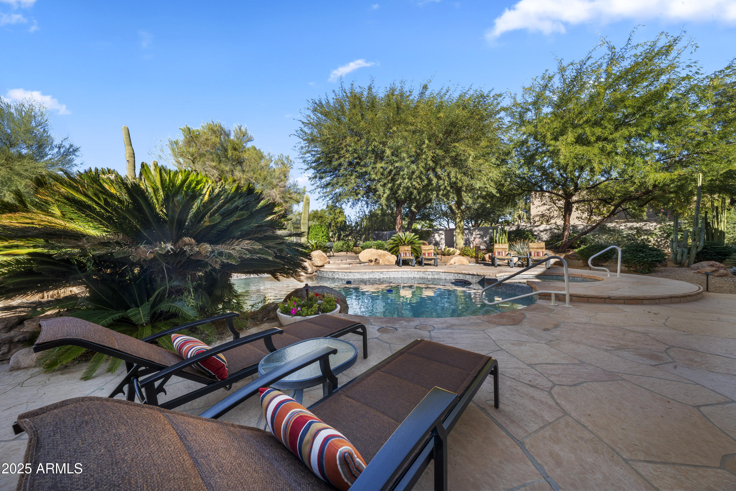 8350 East Via Del Sol Drive Scottsdale, AZ 85255 - Photo 6 of 42 a view of a backyard with sitting area