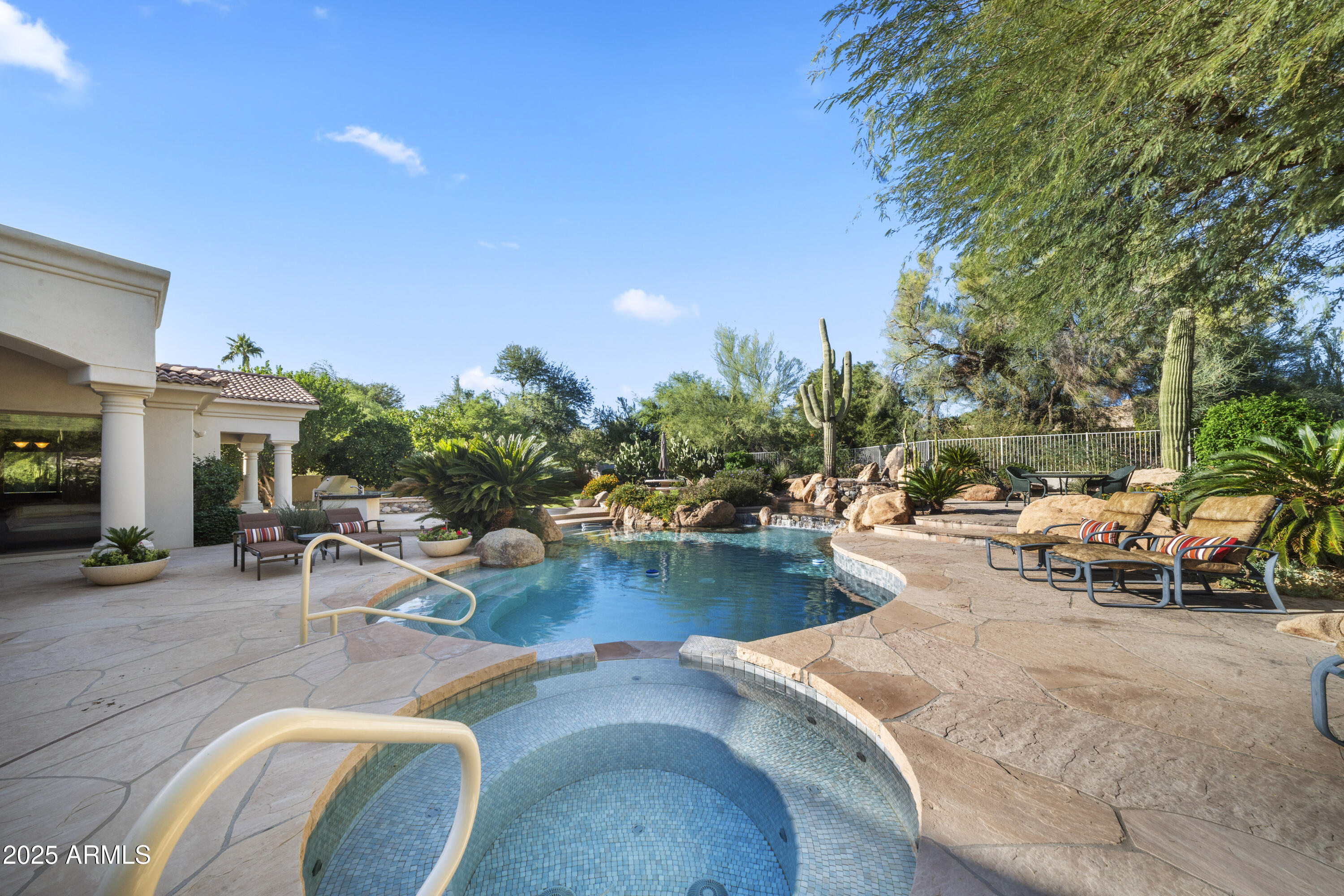 8350 East Via Del Sol Drive Scottsdale, AZ 85255 - Photo 7 of 42 a view of swimming pool with outdoor seating and plants