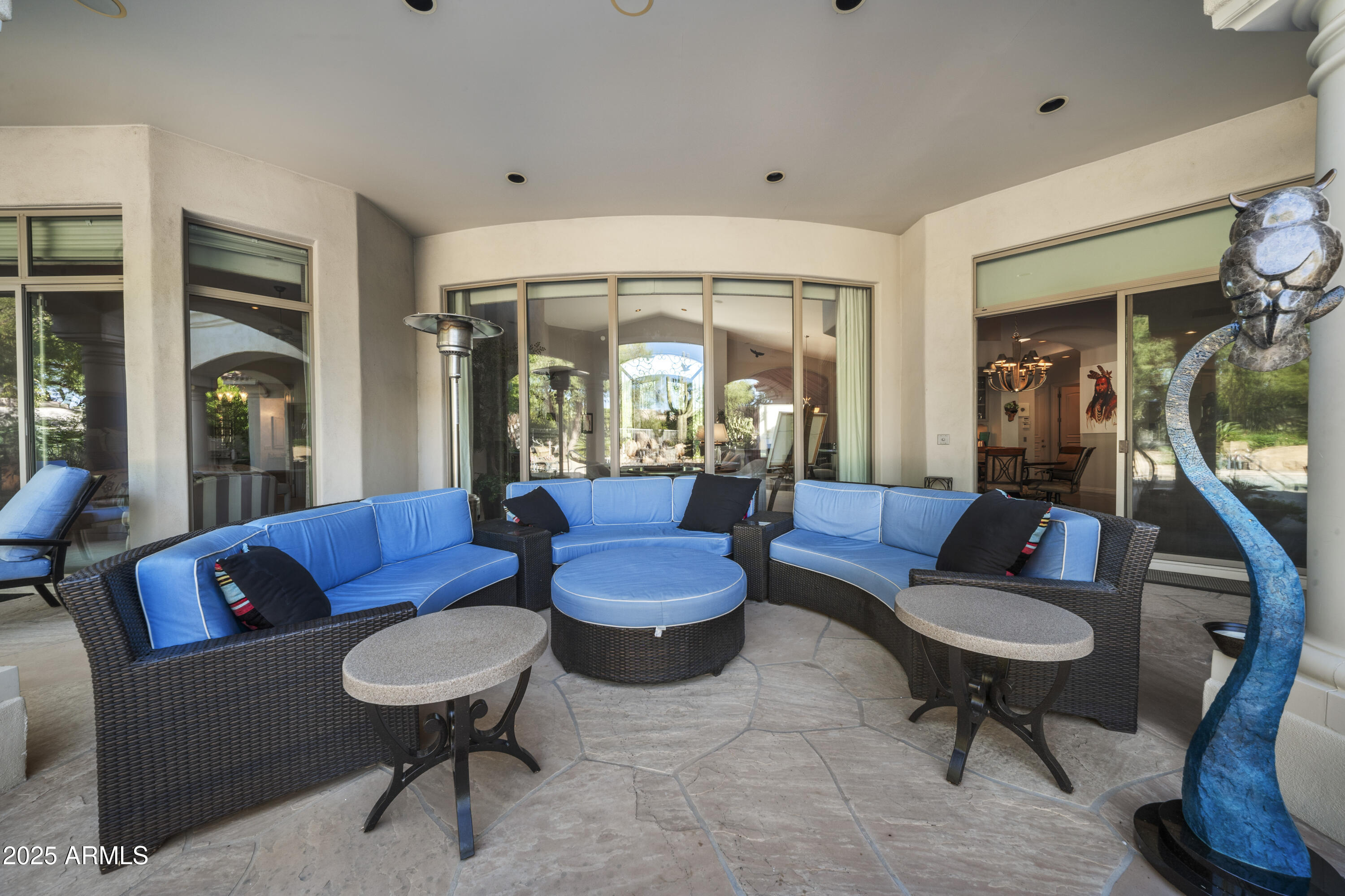 8350 East Via Del Sol Drive Scottsdale, AZ 85255 - Photo 8 of 42 a living room with furniture and a potted plant