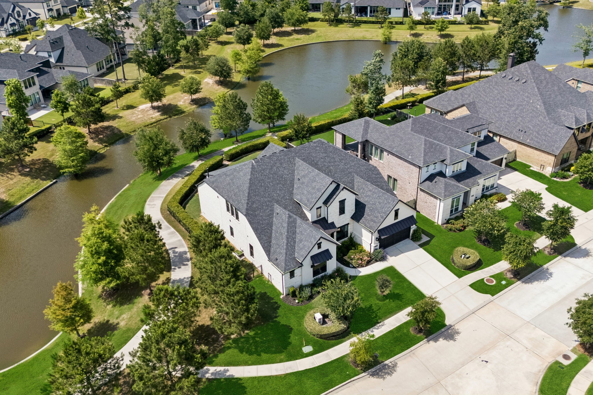 10102 South Goshawk Trail Conroe, TX 77385 - Photo 41 of 46 an aerial view of a house with outdoor space and lake view