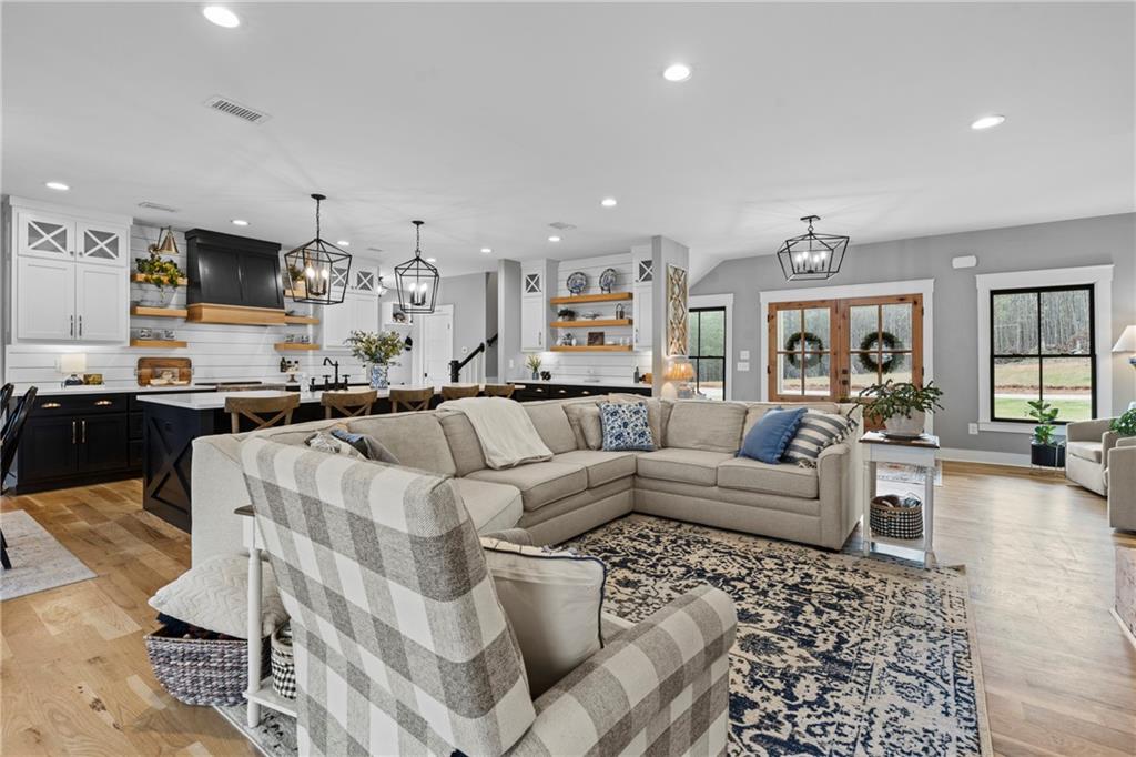 211 Cowart Road Dawsonville, GA 30534 - Photo 23 of 101 a living room with furniture kitchen view and a large window