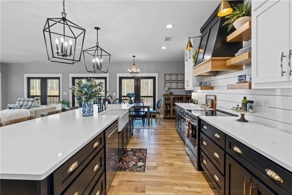 211 Cowart Road Dawsonville, GA 30534 - Photo 27 of 101 a large kitchen with lots of counter space a sink and appliances
