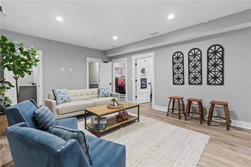 211 Cowart Road Dawsonville, GA 30534 - Photo 38 of 101 a living room with furniture and a potted plant