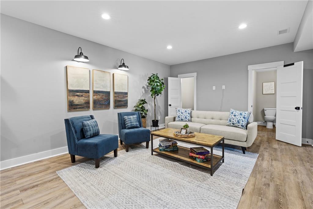 211 Cowart Road Dawsonville, GA 30534 - Photo 39 of 101 a living room with furniture and wooden floor