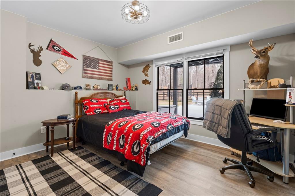 211 Cowart Road Dawsonville, GA 30534 - Photo 41 of 101 a bedroom with a bed and a window