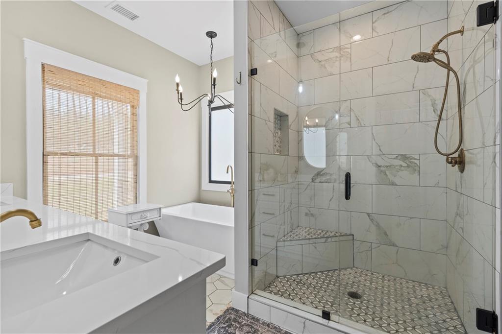 211 Cowart Road Dawsonville, GA 30534 - Photo 55 of 101 a bathroom with a sink a toilet and shower