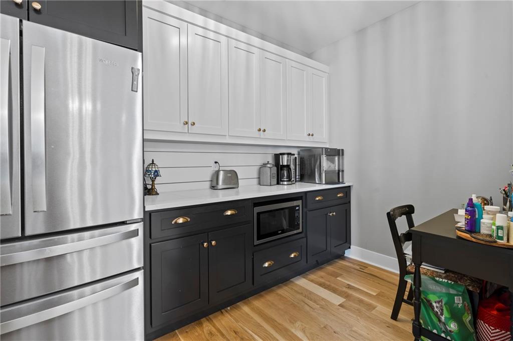211 Cowart Road Dawsonville, GA 30534 - Photo 60 of 101 a kitchen with stainless steel appliances granite countertop a refrigerator and cabinets