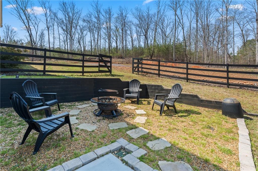 211 Cowart Road Dawsonville, GA 30534 - Photo 86 of 101 a view of a bench in a patio