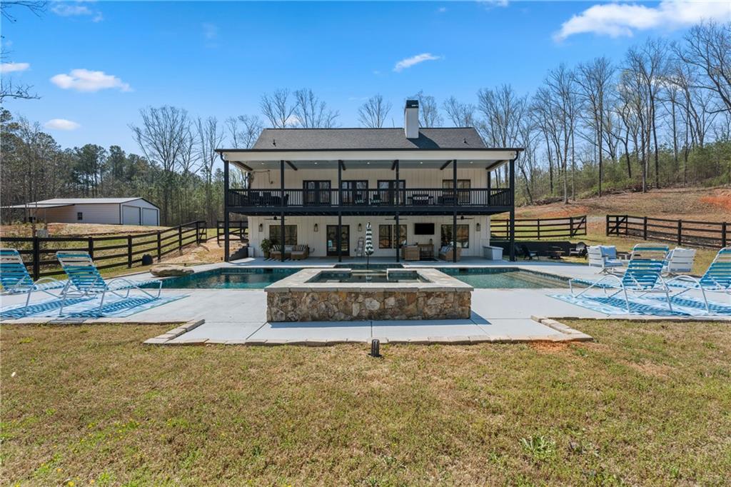 211 Cowart Road Dawsonville, GA 30534 - Photo 90 of 101 a view of a house with swimming pool and sitting area