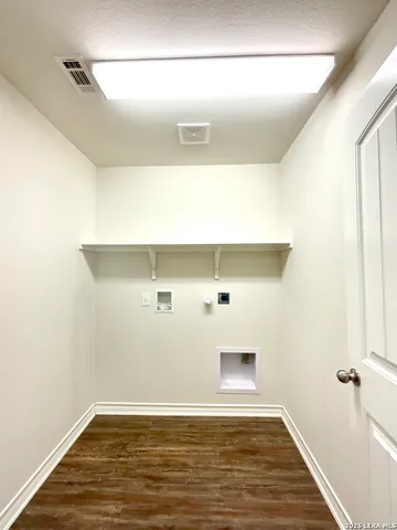 a bathroom with a bathtub sink and mirror