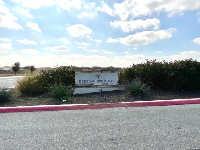 a bedroom with window and a ceiling fan