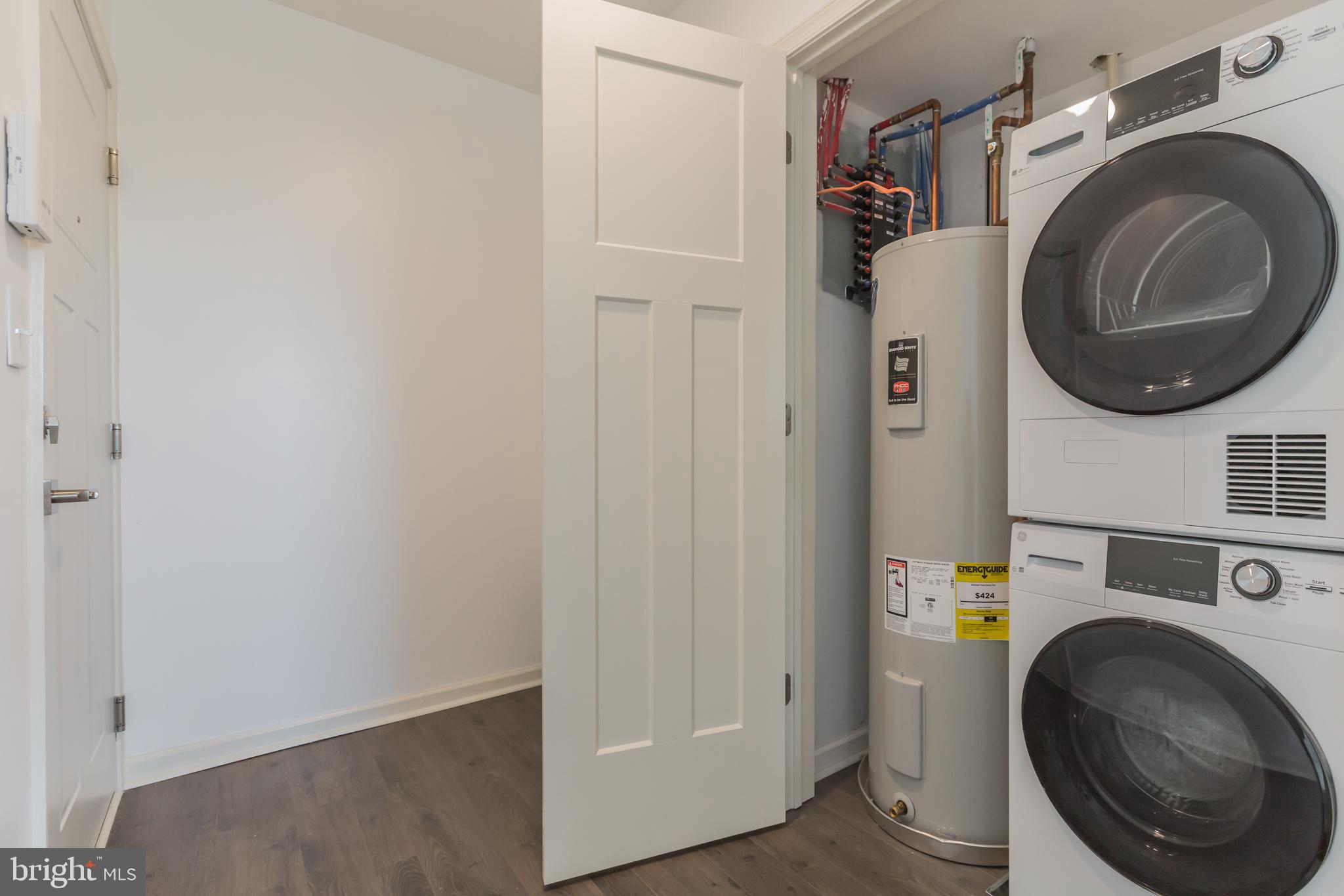 6778 Ridge Avenue, Unit 406 Philadelphia, PA 19128 - Photo 10 of 11 a utility room with dryer and washer