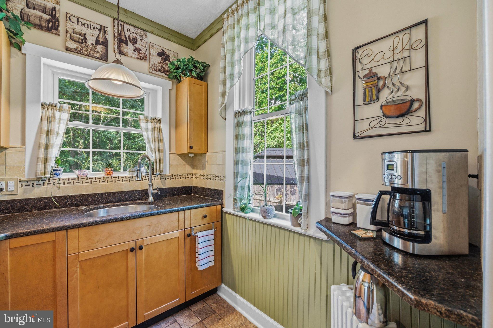 522 Old Hammonds Ferry Road Linthicum Heights, MD 21090 - Photo 13 of 109 Charming kitchen with natural light and greenery.