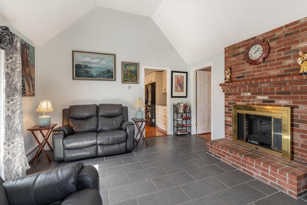 10 John Road Peabody, MA 01960 - Photo 17 of 35 a living room with furniture and a fireplace