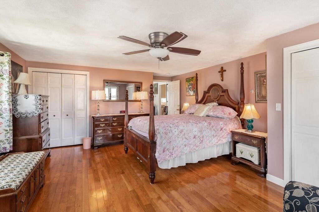 10 John Road Peabody, MA 01960 - Photo 20 of 35 a bedroom with a bed and wooden floor