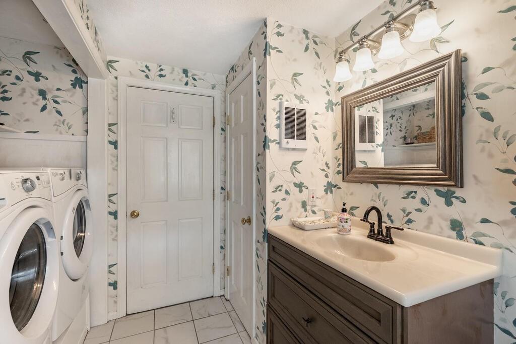 10 John Road Peabody, MA 01960 - Photo 23 of 35 a bathroom with a sink vanity and a mirror