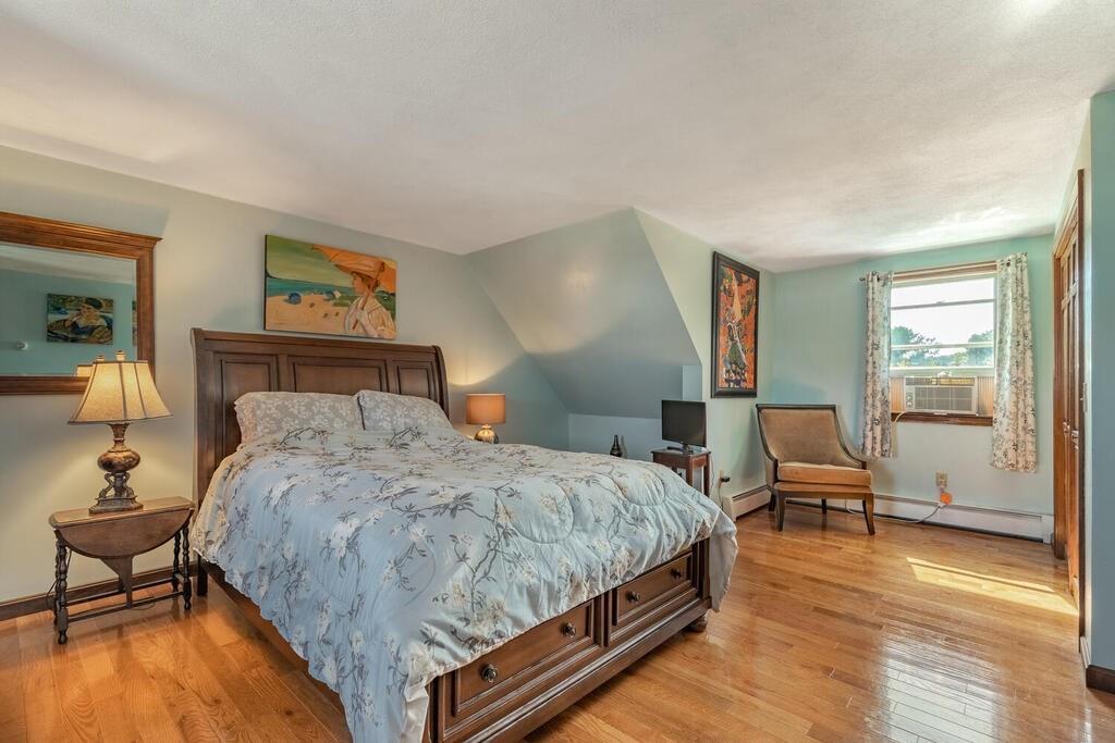 10 John Road Peabody, MA 01960 - Photo 25 of 35 a bedroom with a bed and wooden floor